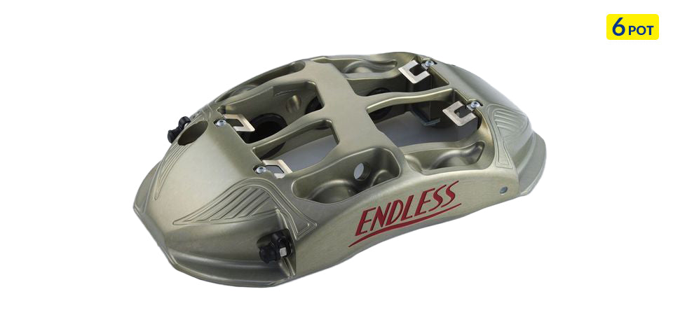 Endless six-piston racing brake caliper